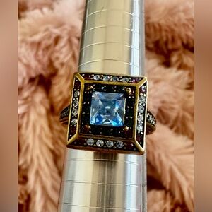 Heidi Daus cocktail ring in antique gold colored metal with Swarovski crystals.